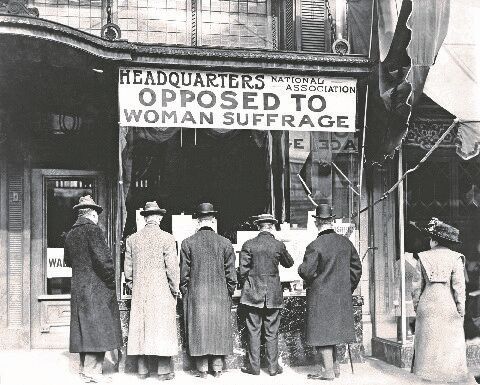 Men look in the window of the National Anti-Suffrage Association headquarters, which was active at the state and national levels. Many women opposed suffrage as well. (ca. 1911)